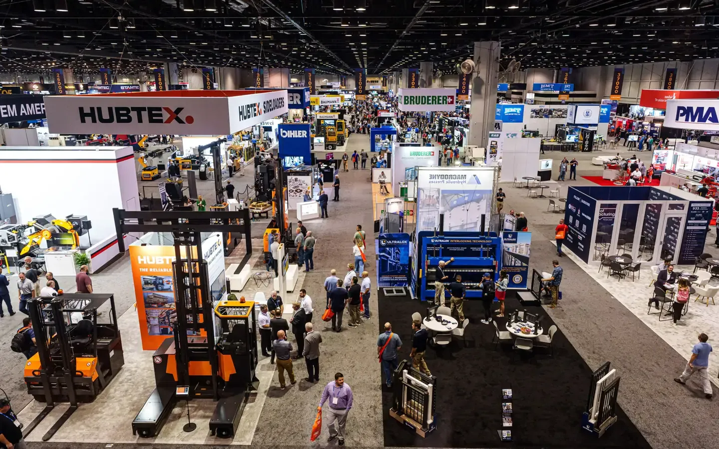 Crowded FABTECH show floor with exhibitor booths and machinery at FABTECH 2024